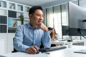 man using computer at office