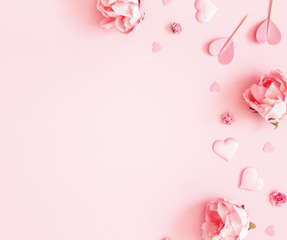 Paper hearts and flowers on pink paper
