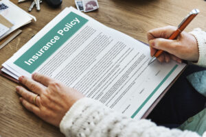 An insurance agent looking over an insurance policy document