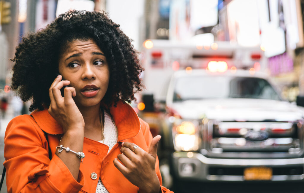 Woman on the phone after car accident