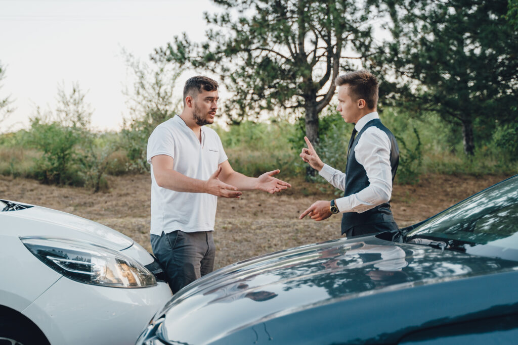 Two men arguing after a car accident