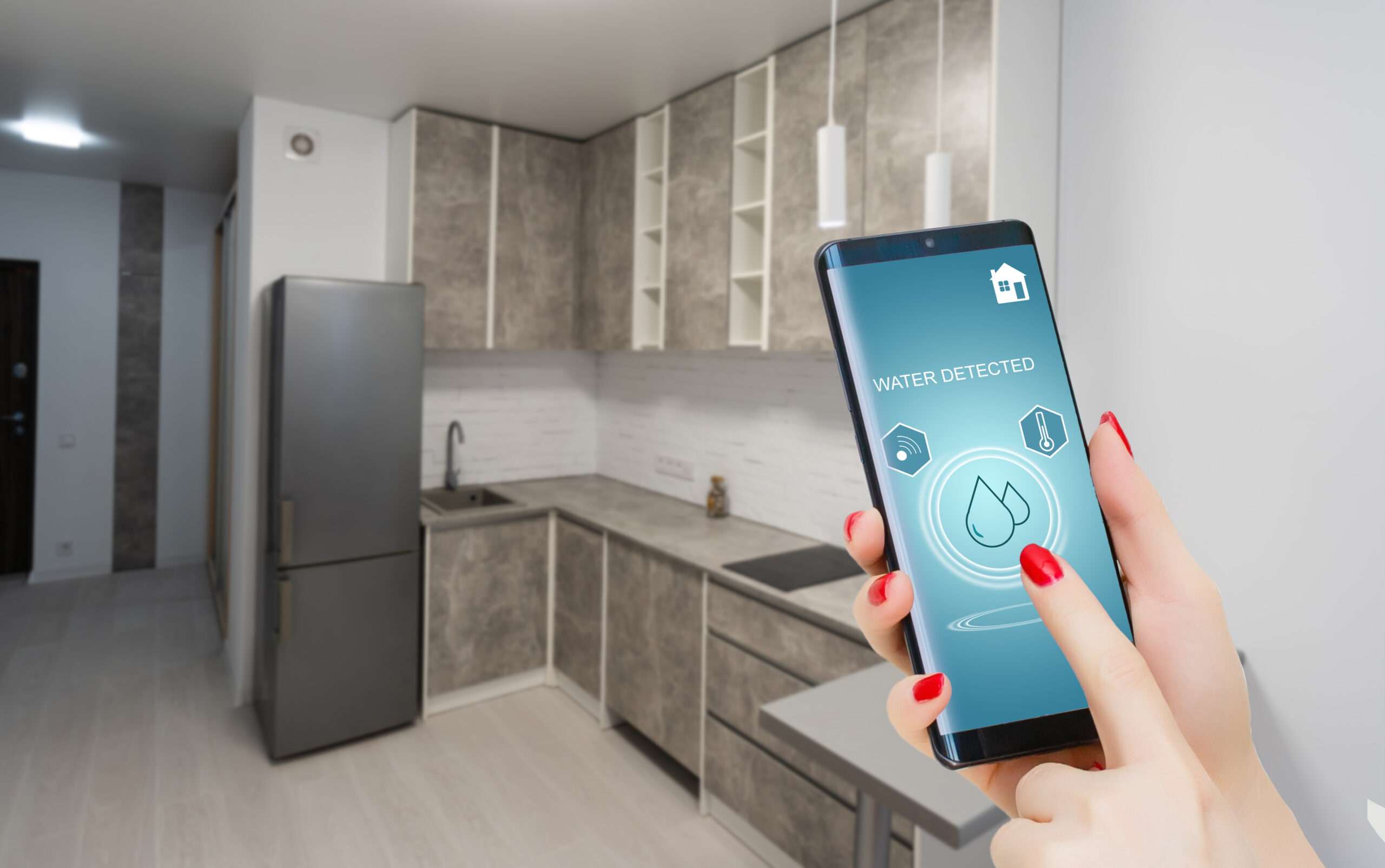 Person checking their water sensor in their home on their cell phone.