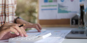 closeup of business owner paying bills