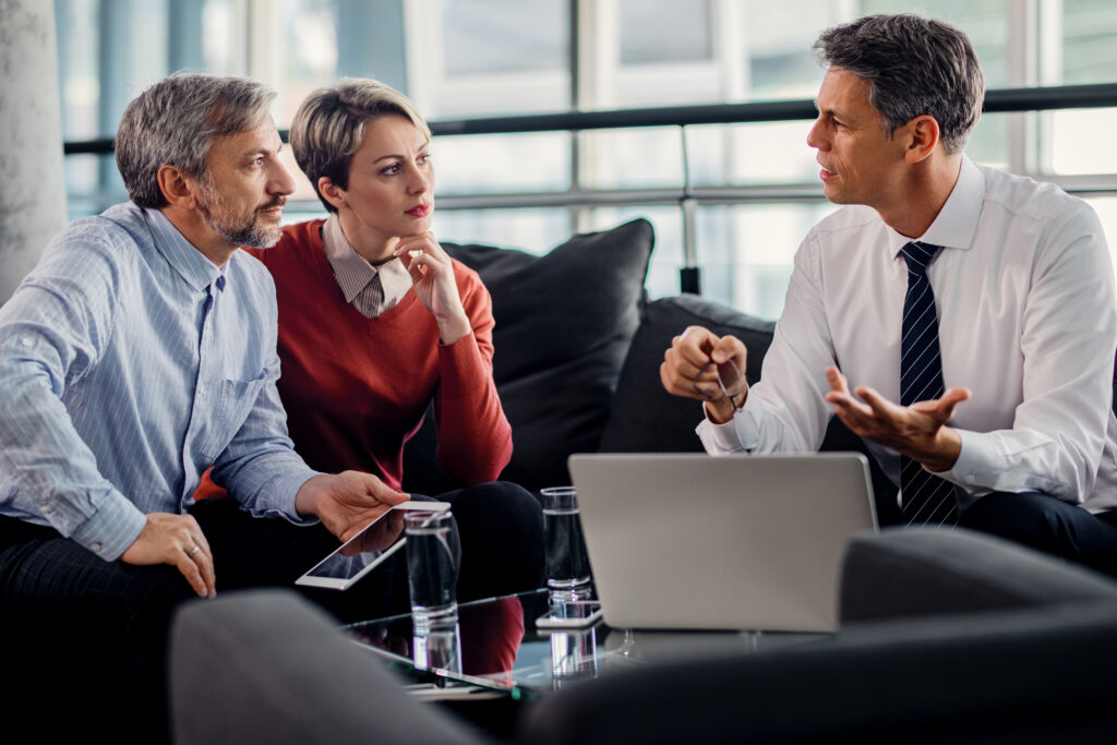 Insurance agent talking with his clients