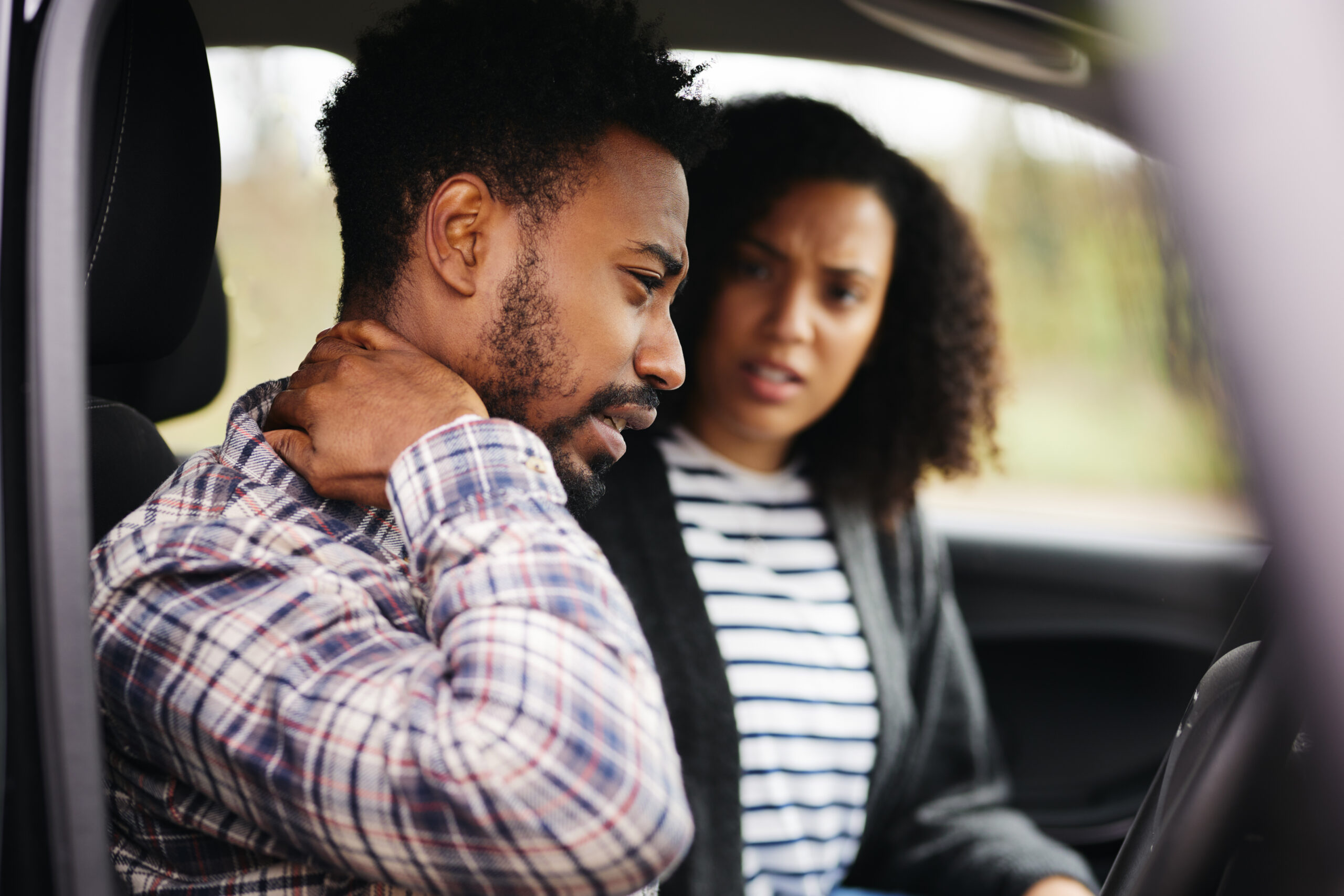 couple in car after accident with neck injury