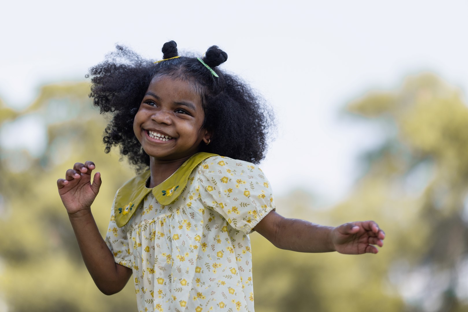 young girl playing outside