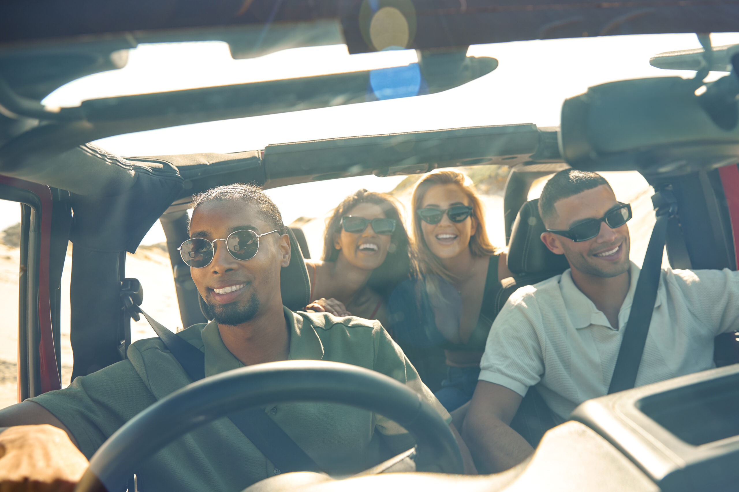 Group of friends riding in a JEEP