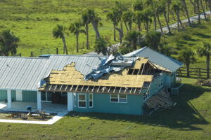 Home with damaged roof from hurricane