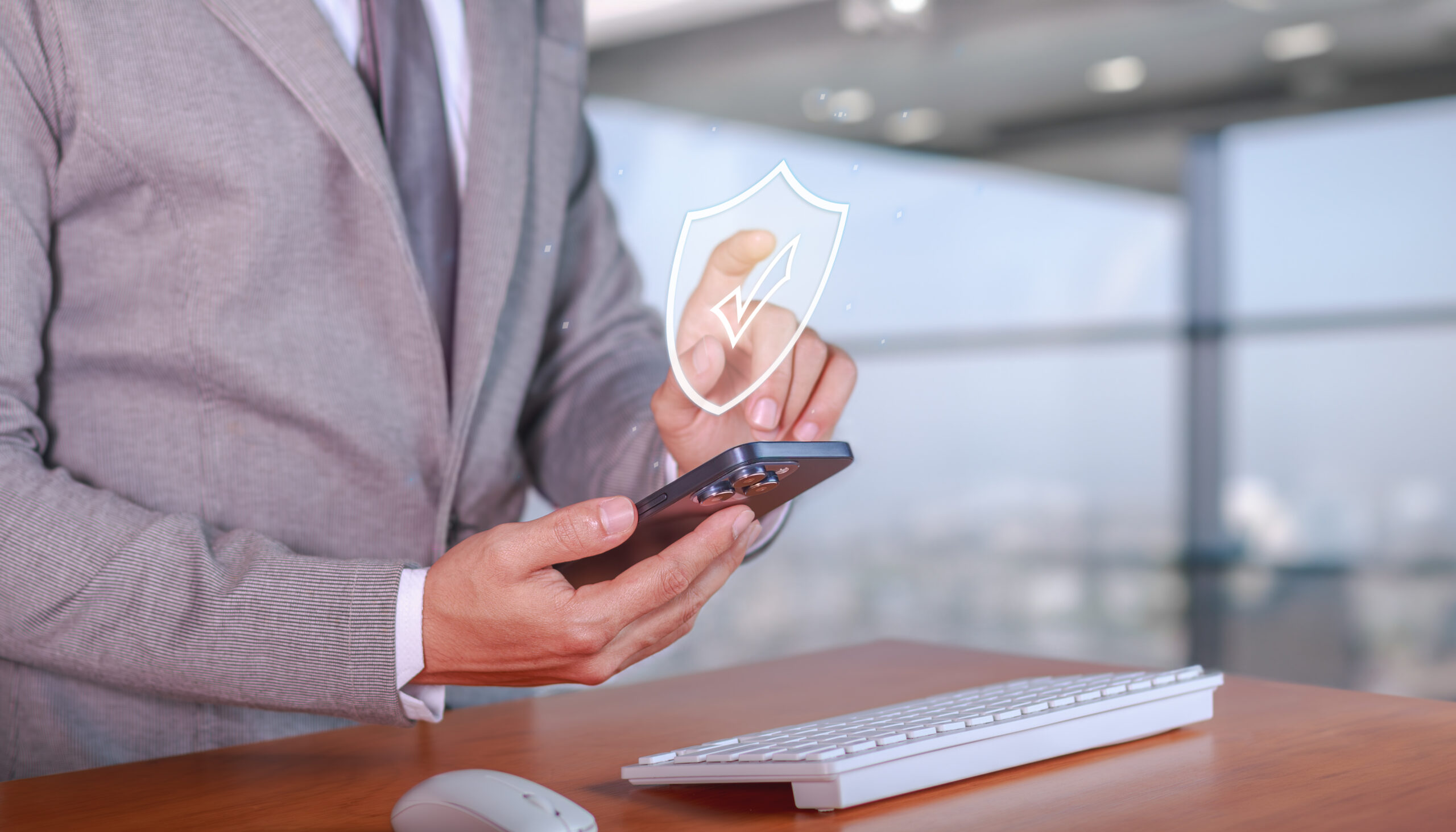 business man using cybersecurity tech on phone