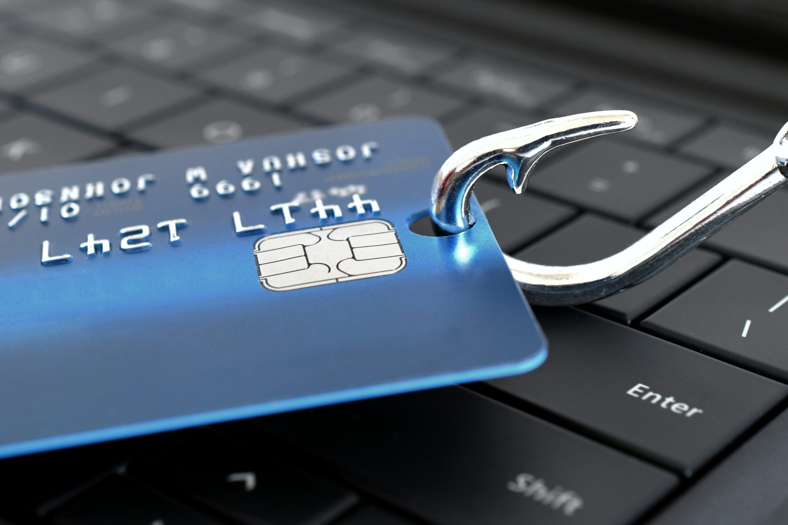 fish hook poked through credit card