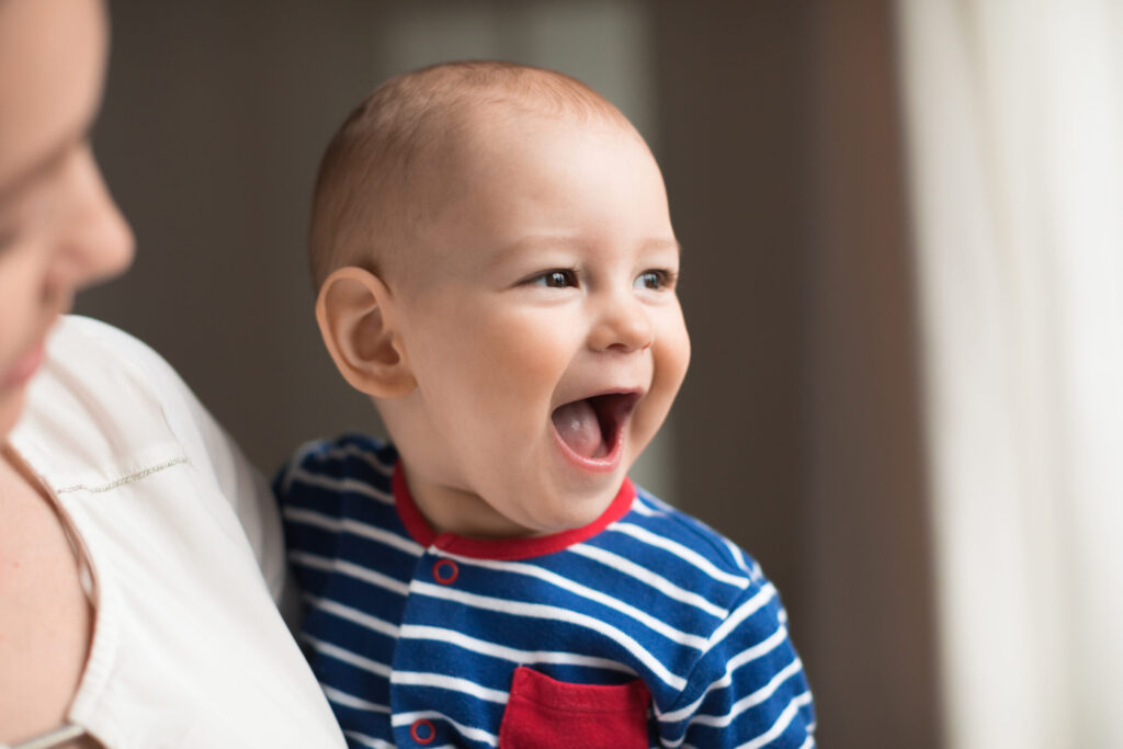 Happy smiling baby boy, close-up portrait