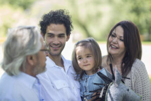 Smiling extended family outdoors