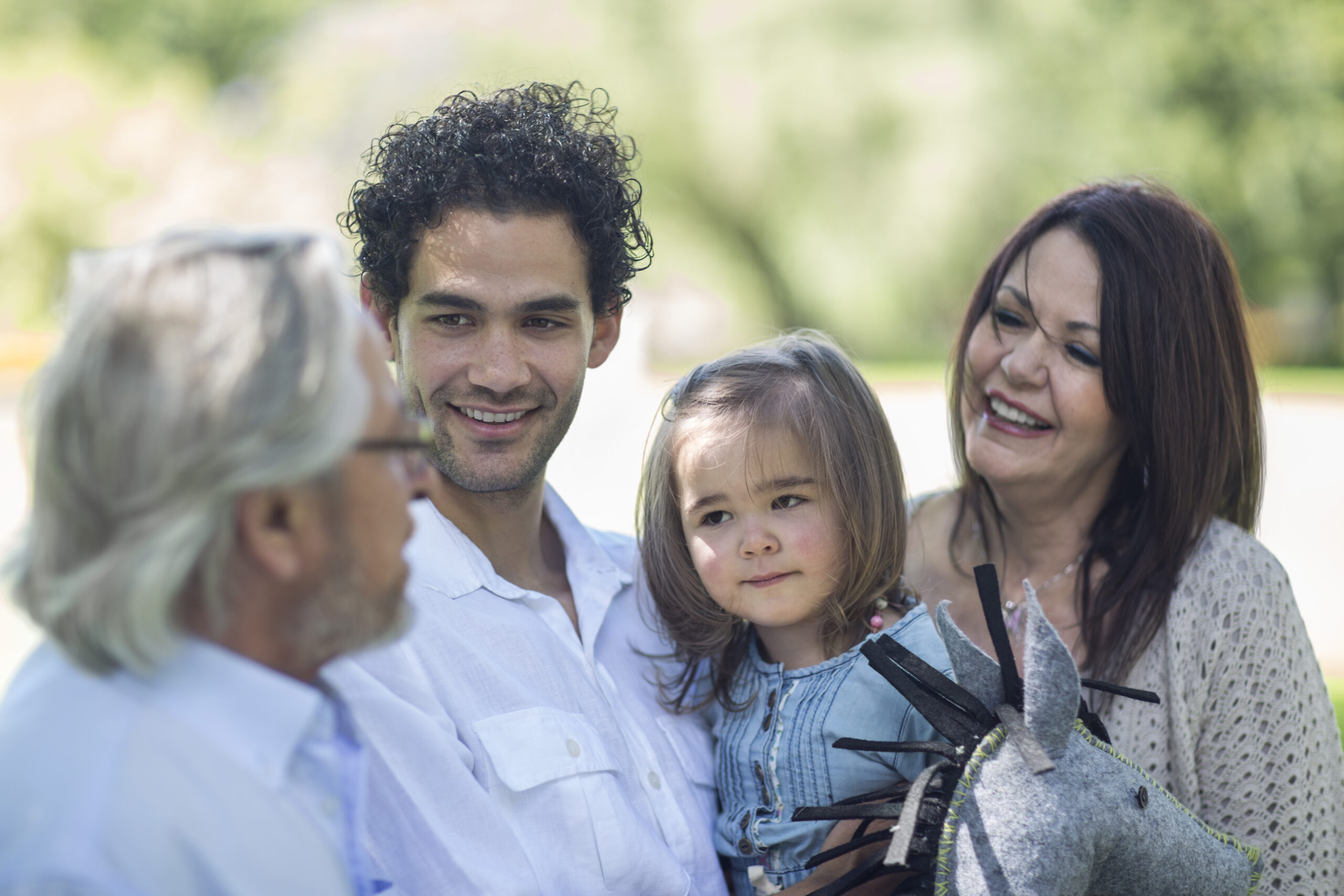 Smiling extended family outdoors