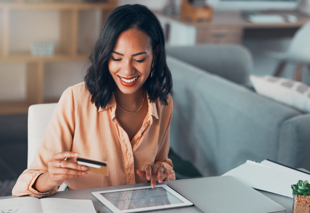 Shopping for online purchase with credit card and tablet, buying products for house and making paym.