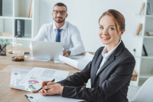 smiling professionals in office