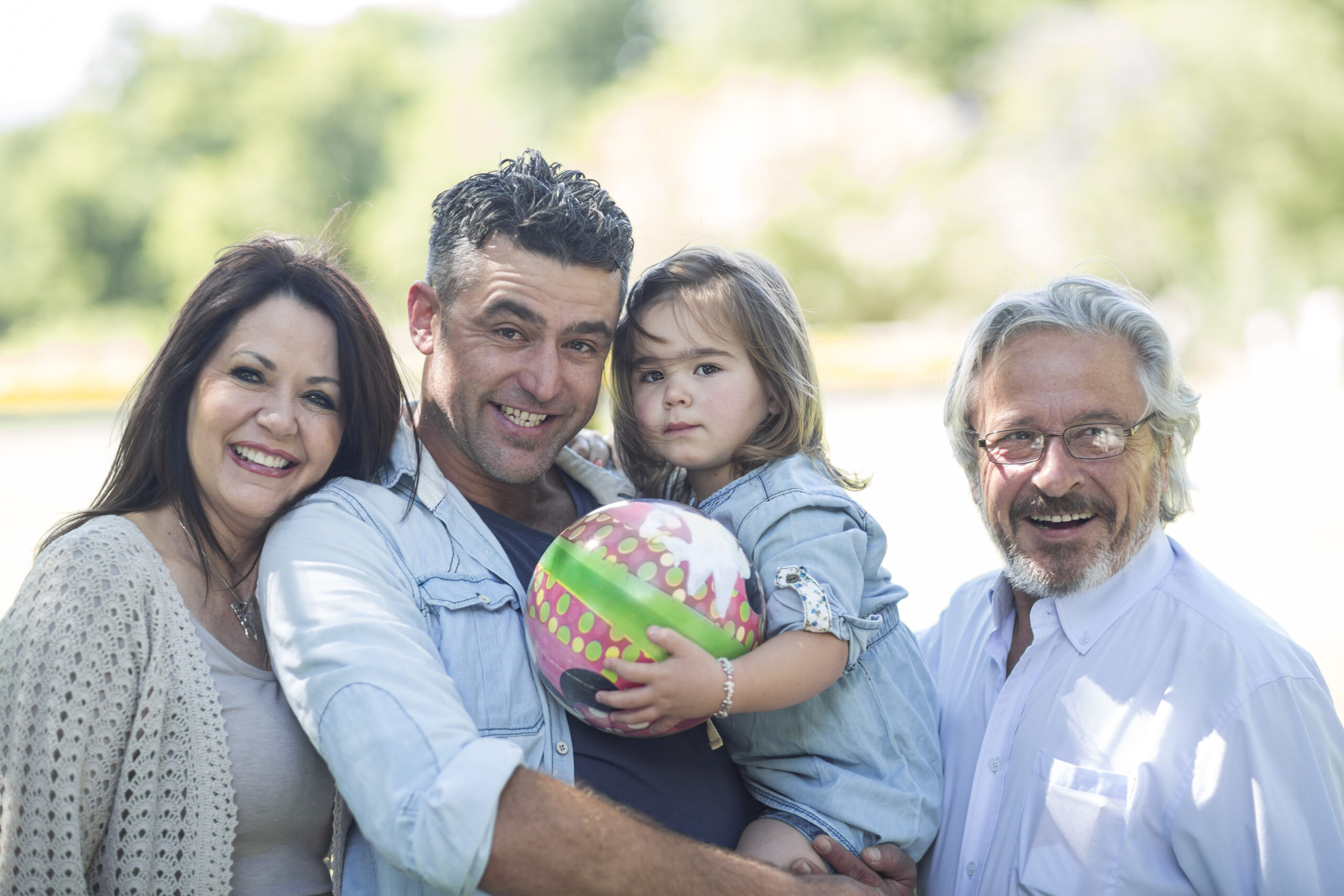 Smiling family outdoors